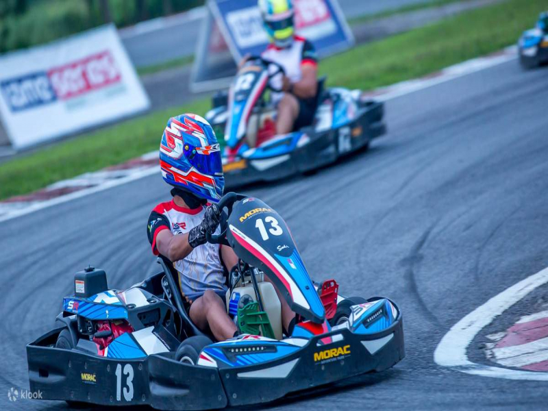Tourist taking a turn with go-kart at Morac Adventure Park Langkawi